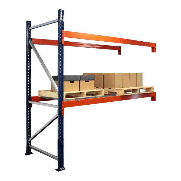 A blue and orange Interlake Mecalux heavy-duty bolted pallet rack with shelves holding boxes.