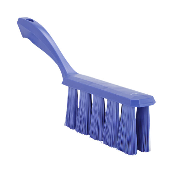 A purple bench brush with long bristles and a blue plastic handle.