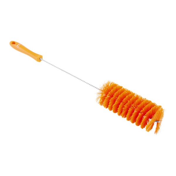 A close up of a Vikan orange tube brush with a handle.