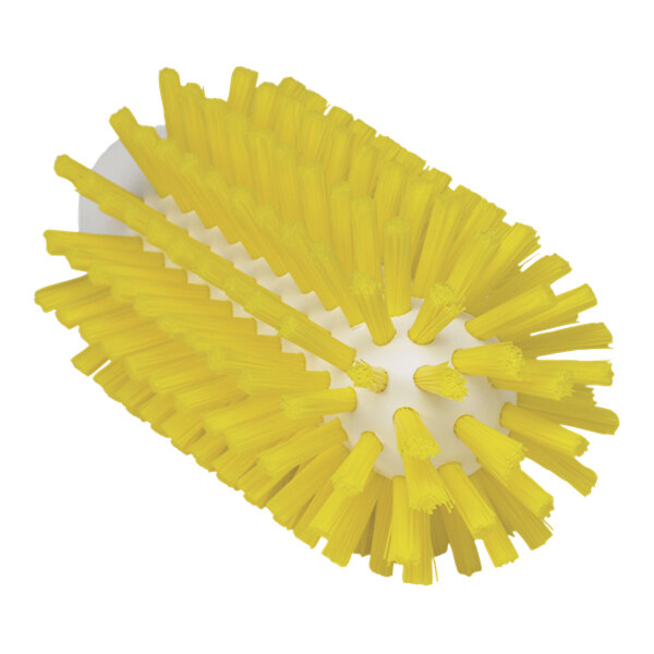 A close up of a Vikan yellow stiff tube brush head with white bristles.