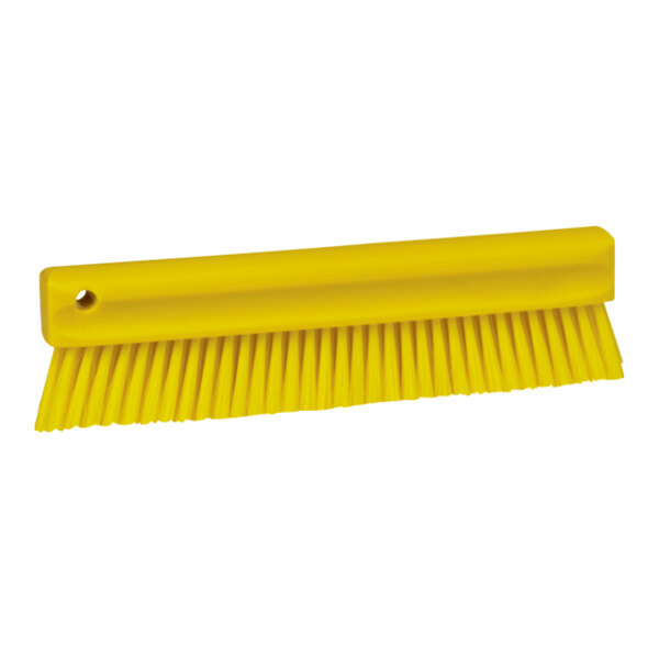 A Vikan yellow brush with soft bristles.