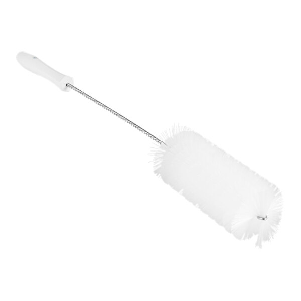 A white brush with a long handle.