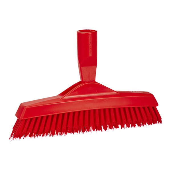 A Vikan red brush with a handle.