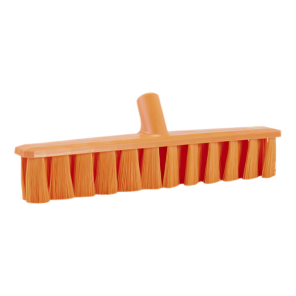 An orange Vikan broom head with soft bristles.