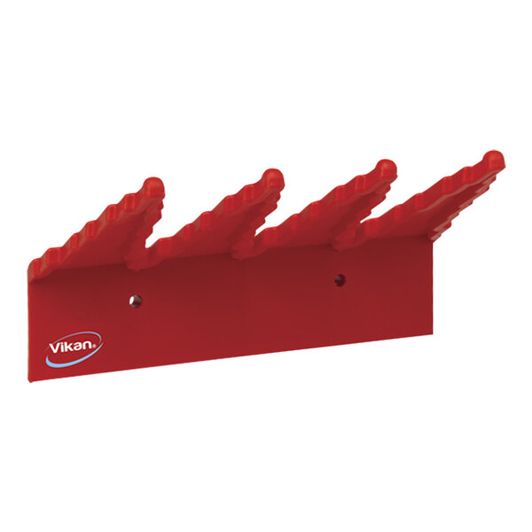 A red Vikan wall bracket with spikes.