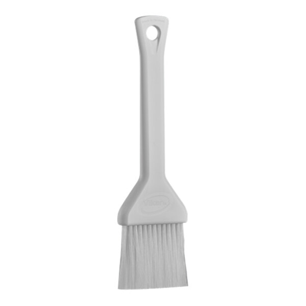 A Vikan white pastry brush with a plastic handle.