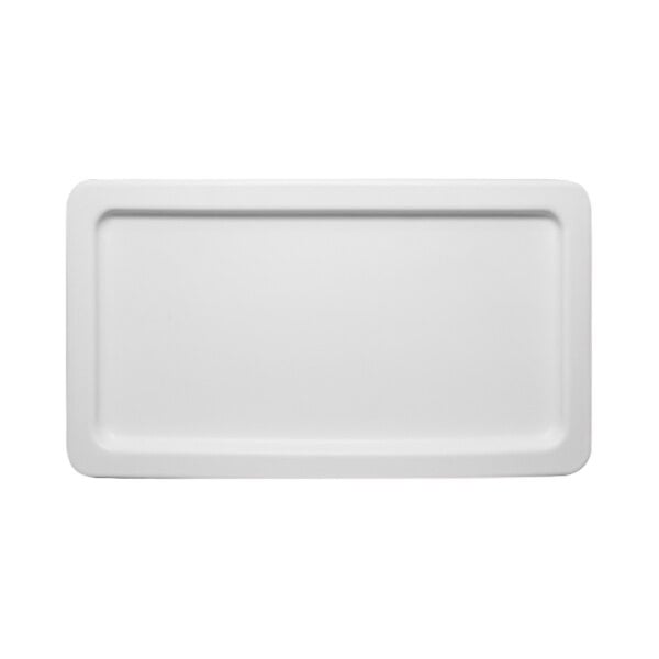 A white Remco polyethylene lid on a white rectangular object.