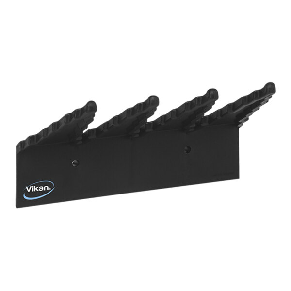 A black plastic Vikan wall bracket with three hooks.