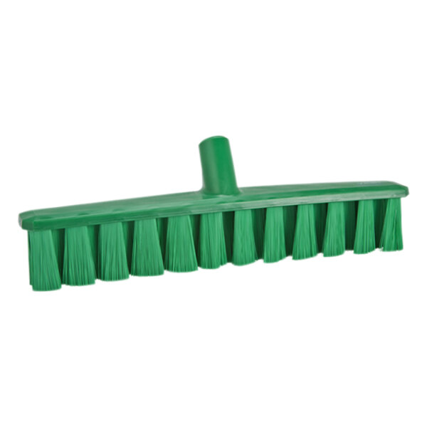 A green broom head with medium bristles.