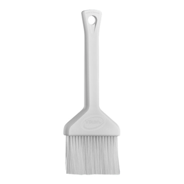 A Vikan white pastry brush with a white plastic handle.