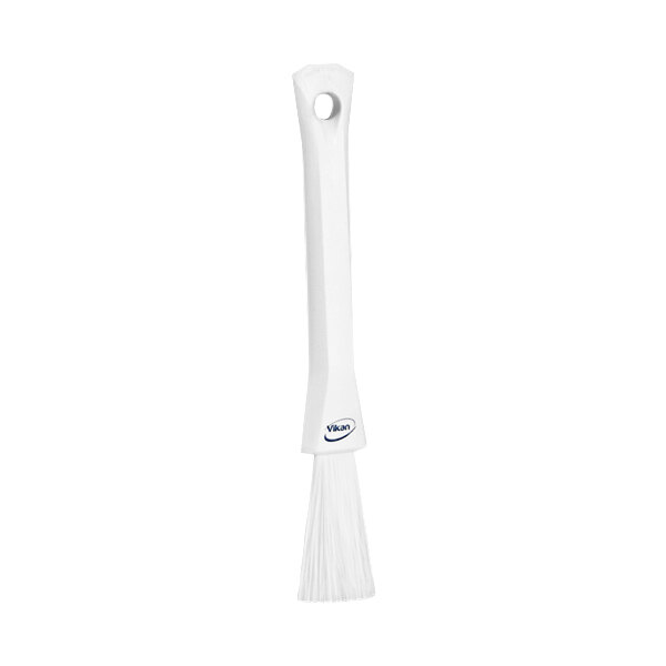 A white rectangular Vikan detail brush with a black top and soft bristles.