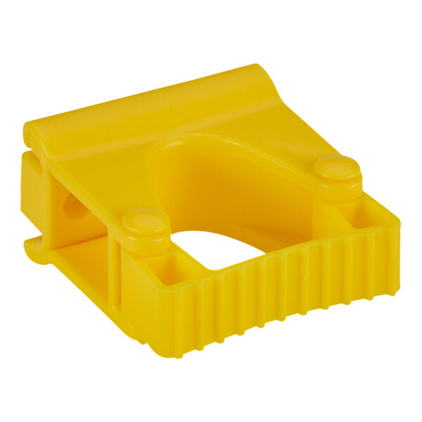 A yellow plastic Vikan grip band holder with a circle and holes.
