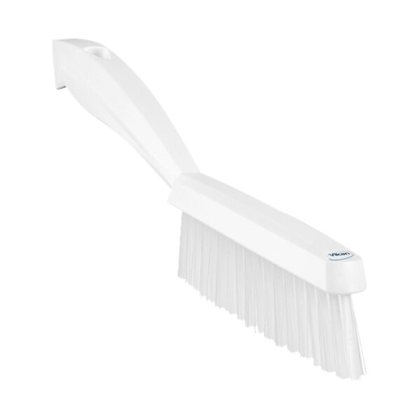 A close-up of a white Vikan narrow hand brush with short handle and extra stiff bristles.