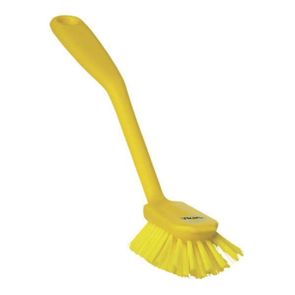 A yellow Vikan dish brush with a long handle.
