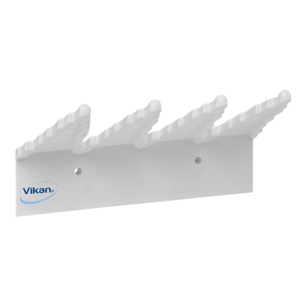 A white plastic Vikan wall bracket with a pointed hook.