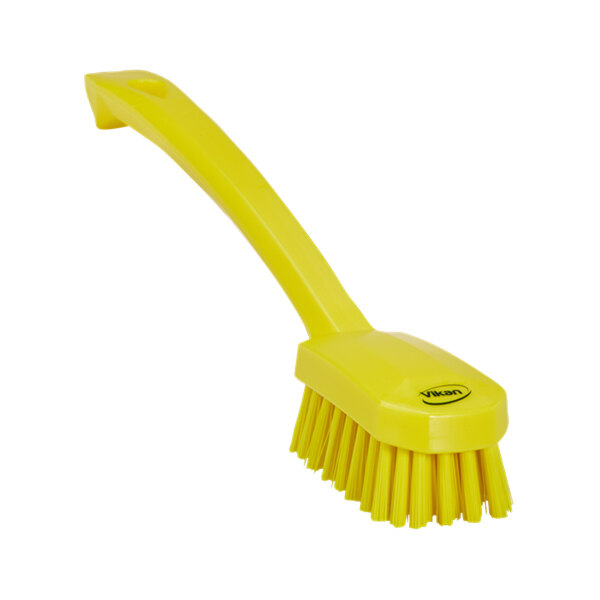 A Vikan yellow utility brush with a long handle.