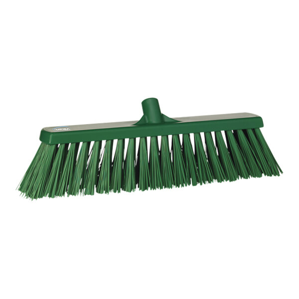 A green broom head with long, stiff bristles.
