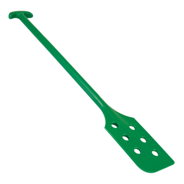 A green paddle with holes on the handle.