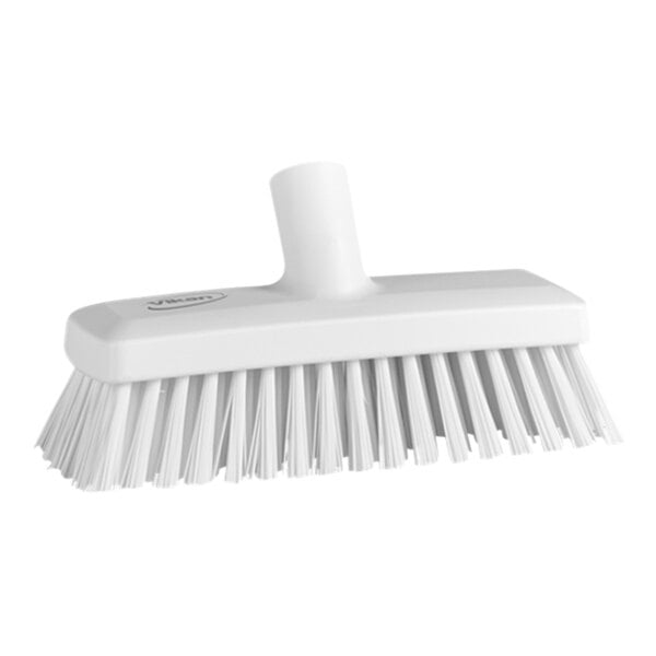 A close-up of a white Vikan wall and deck scrub brush head with stiff bristles.
