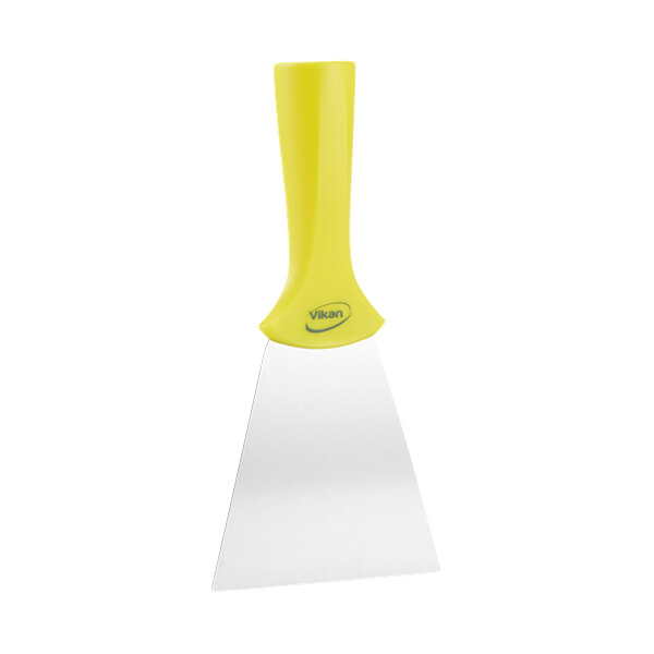 A yellow spatula with a white handle.