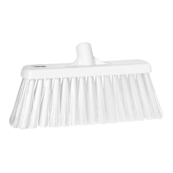 A close-up of a Vikan white push broom head with long bristles.