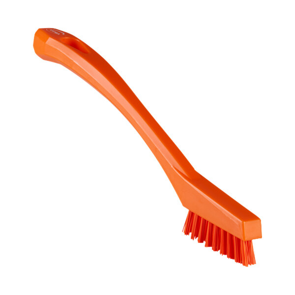 An orange Vikan 44017 detail brush with extra stiff bristles.