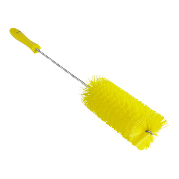A yellow brush with a long handle.
