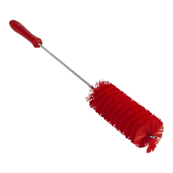 A close-up of a red Vikan tube brush with a long handle.