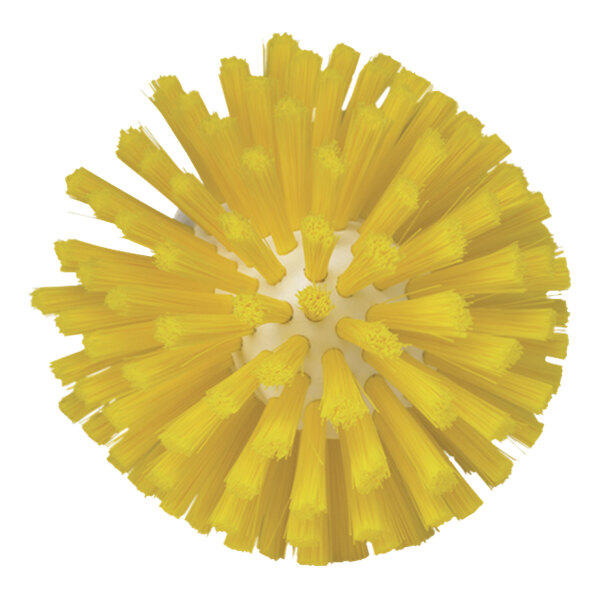 A close-up of a round yellow Vikan meat mincer brush head with bristles.