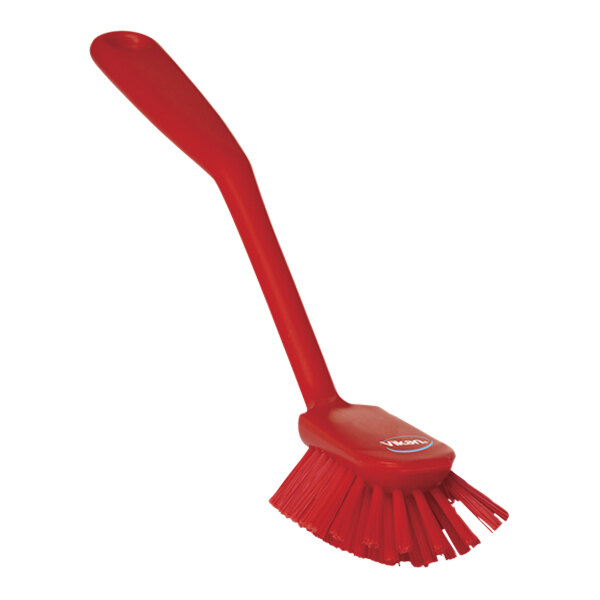 A red Vikan dish brush with a long handle.