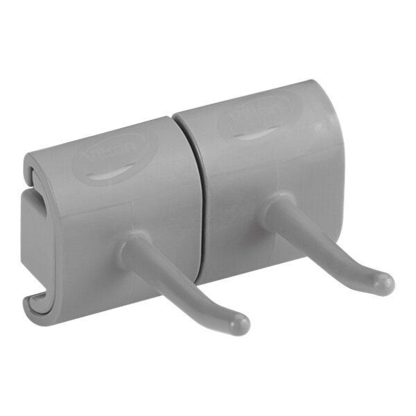 A Vikan gray plastic wall bracket with two hooks.