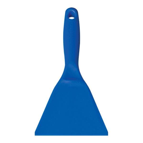 A close-up of a blue plastic spatula with a hole.
