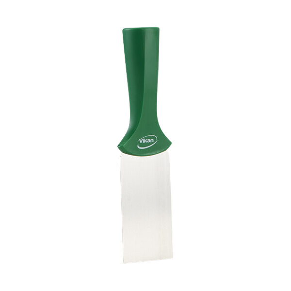 A white rectangular object with a green and white Vikan handle and stainless steel scraper blade.
