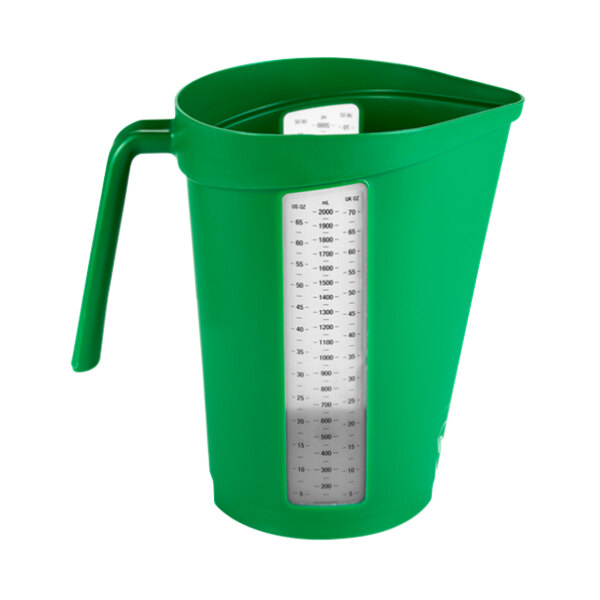 A green plastic measuring jug with a white handle and measuring scale.