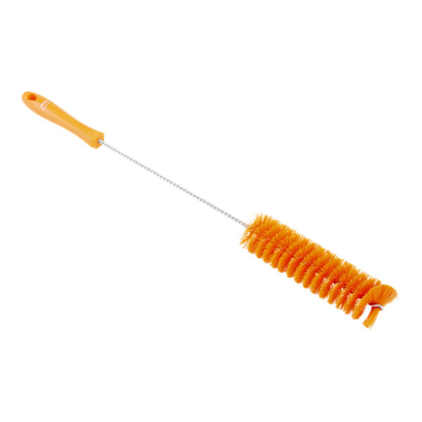 A close-up of a Vikan orange stiff tube brush with a handle.