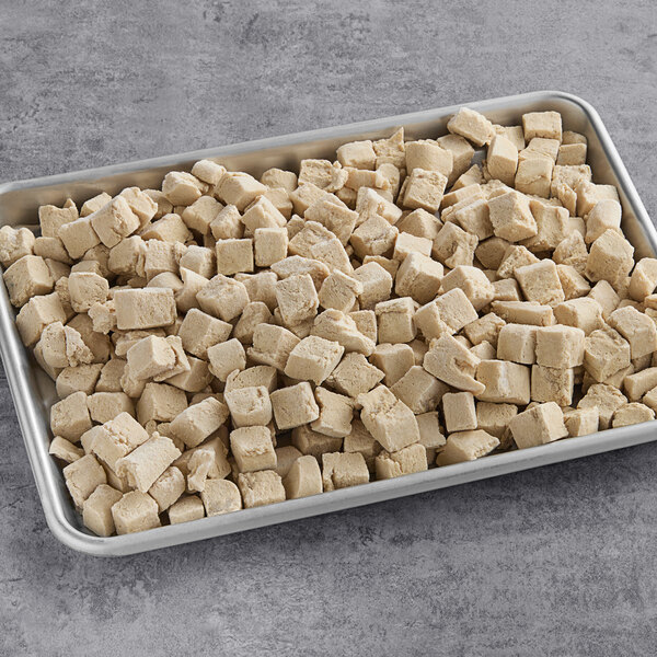 A tray of Gardein Plant-Based Vegan Chick'n cubes on a table.