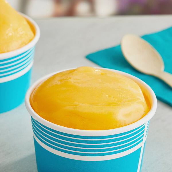 A close up of two cups of yellow Philadelphia Water Ice.