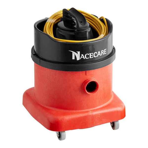 A red and black NaceCare Solutions canister vacuum cleaner on a table.