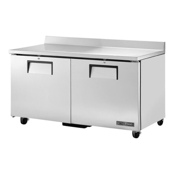 A large stainless steel True worktop freezer with two doors on a counter.