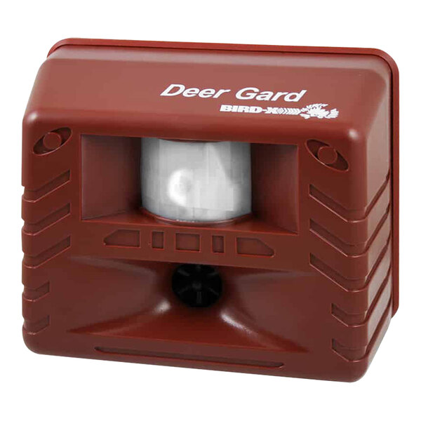 A red plastic box with a white and black ultrasonic repeller.