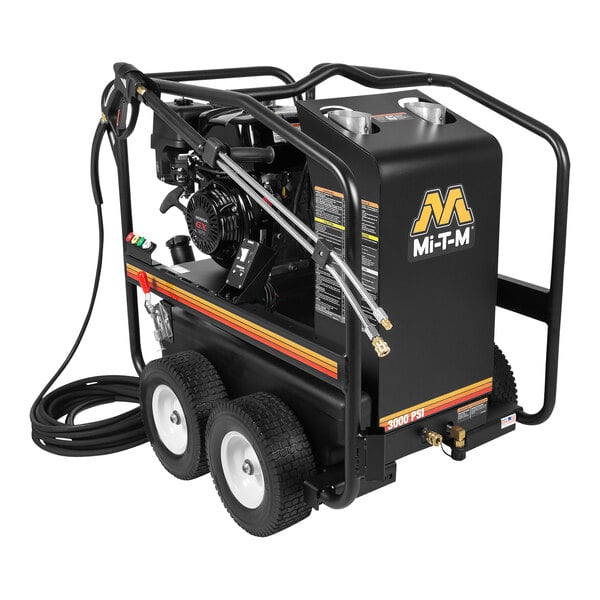 A Mi-T-M hot water pressure washer with a hose attached to it and wheels.
