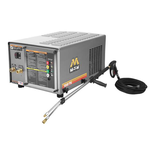 A Mi-T-M electric pressure washer on a table with a hose.