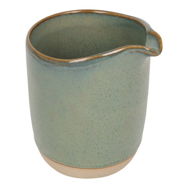 A Front of the House moss green porcelain creamer pitcher with a handle.