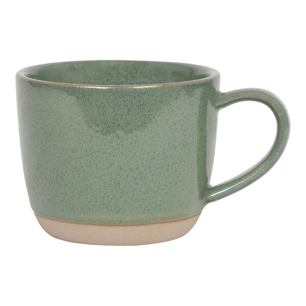 A green porcelain mug with a white rim and handle.