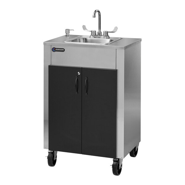 An Ozark River Manufacturing stainless steel portable hand sink with a faucet on wheels.