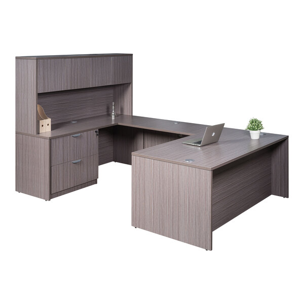 A Boss driftwood laminate desk with lateral storage and a cabinet.