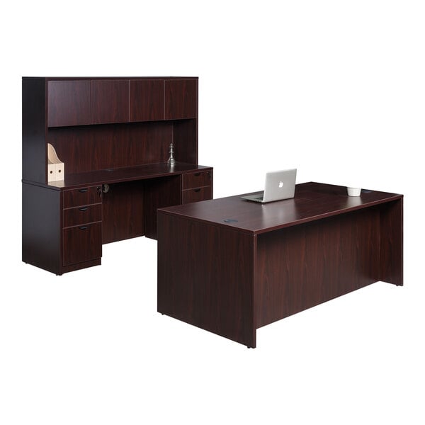 A Boss mahogany laminate desk with hutch, dual storage pedestal, and credenza with a laptop on top.