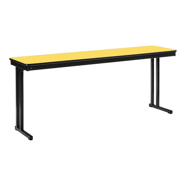 A marigold rectangular table with black legs and a black T-mold edge.