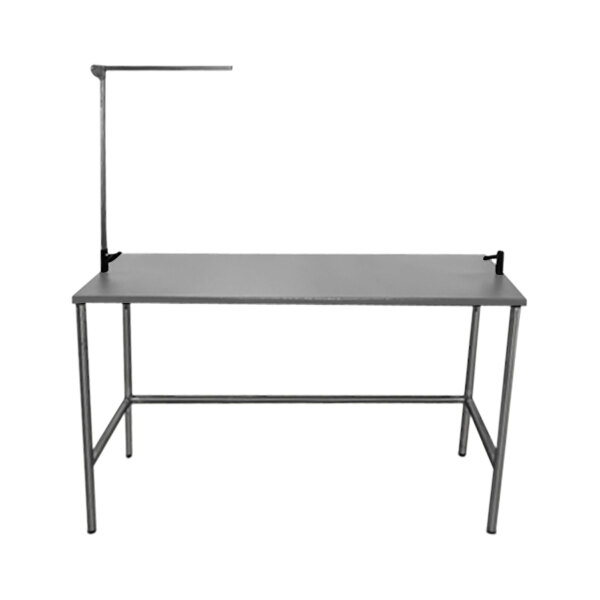 A grey rectangular Groomer's Best stainless steel grooming table with a metal frame.