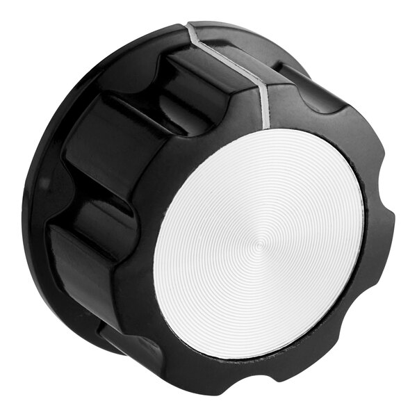 A black and white knob with a silver center.